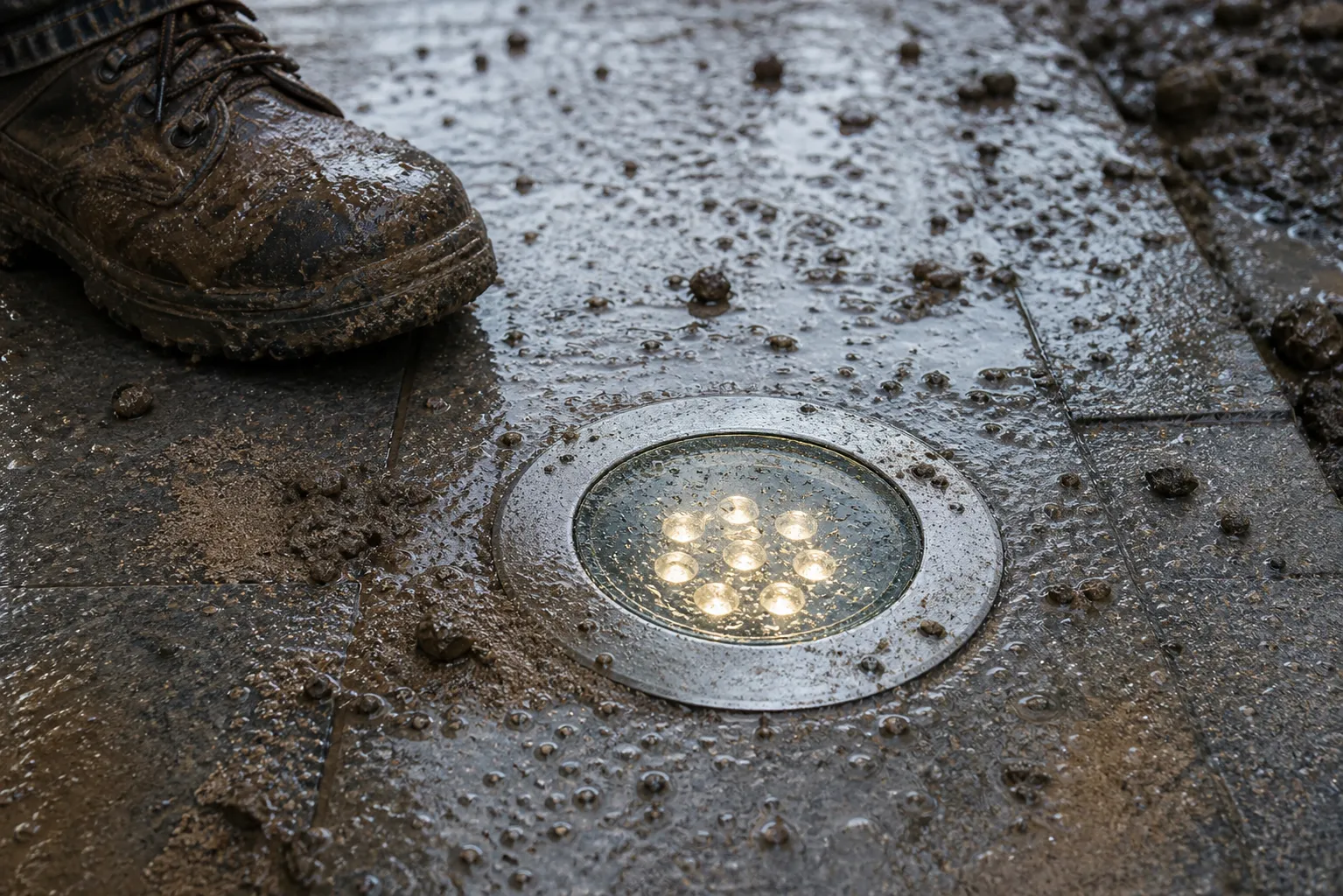 How does outdoor underground light glass deal with rain, sand, and trampling?