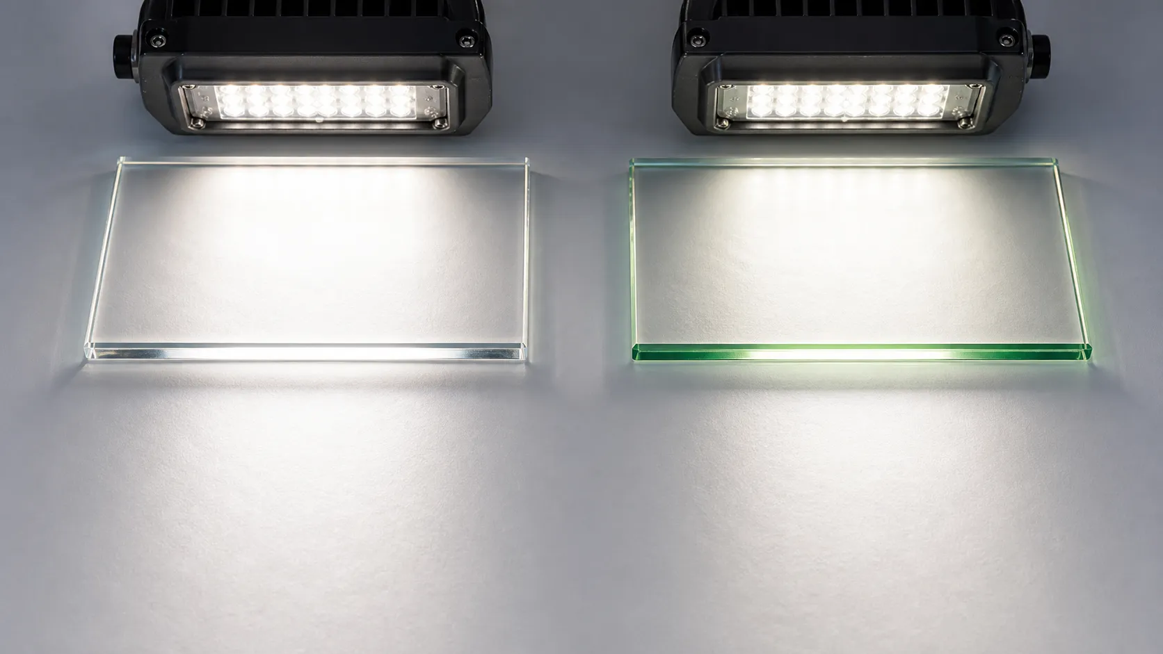 Can low-iron glass significantly improve light transmittance in outdoor lighting?