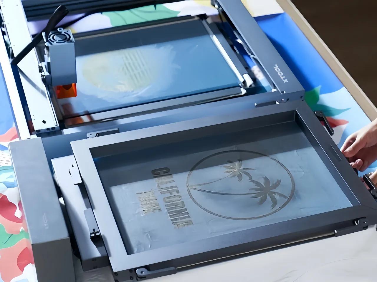 Screen frames and stencil-preparation equipment used before image transfer.