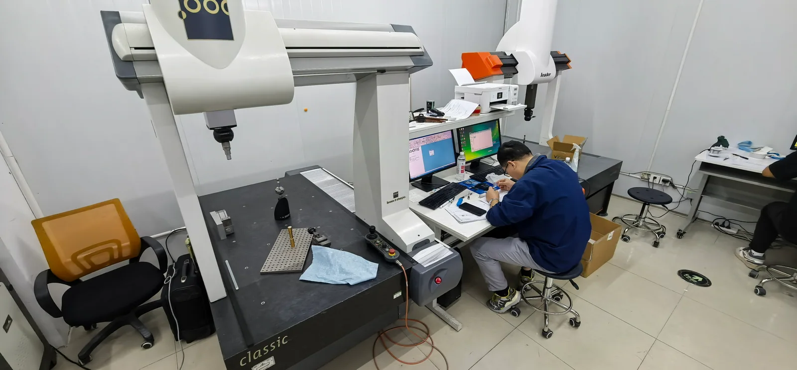 Coordinate measuring equipment and an operator workstation in a measurement room