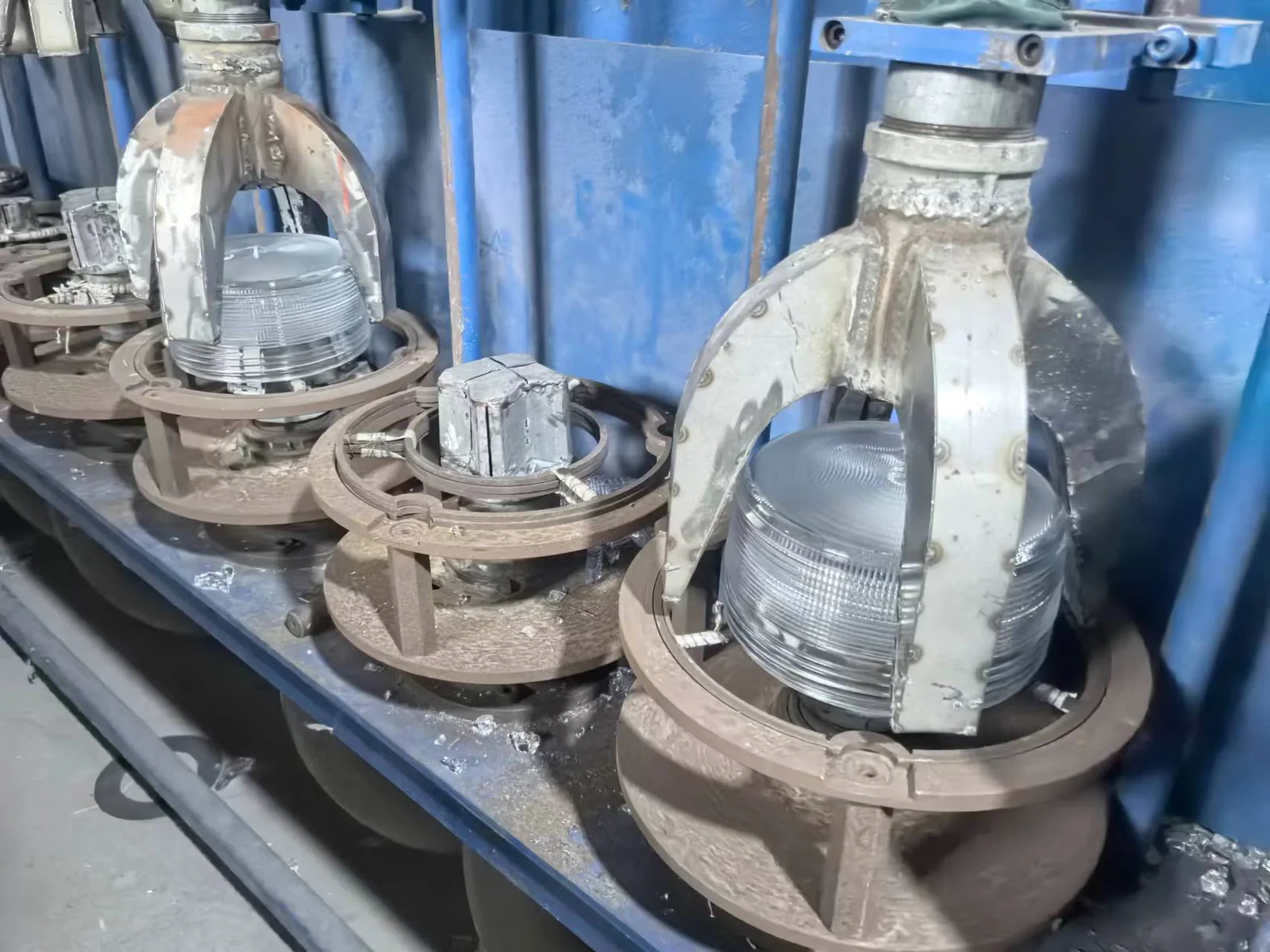 Glass pressing mould assemblies mounted in production equipment