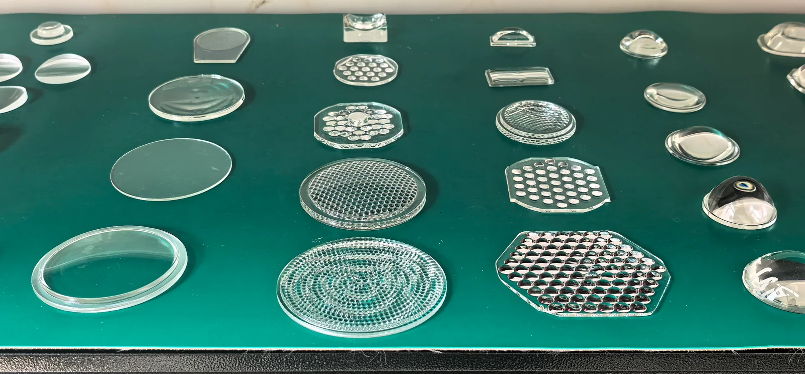 Circular and rectangular glass samples with concentric, ribbed and repeated surface patterns