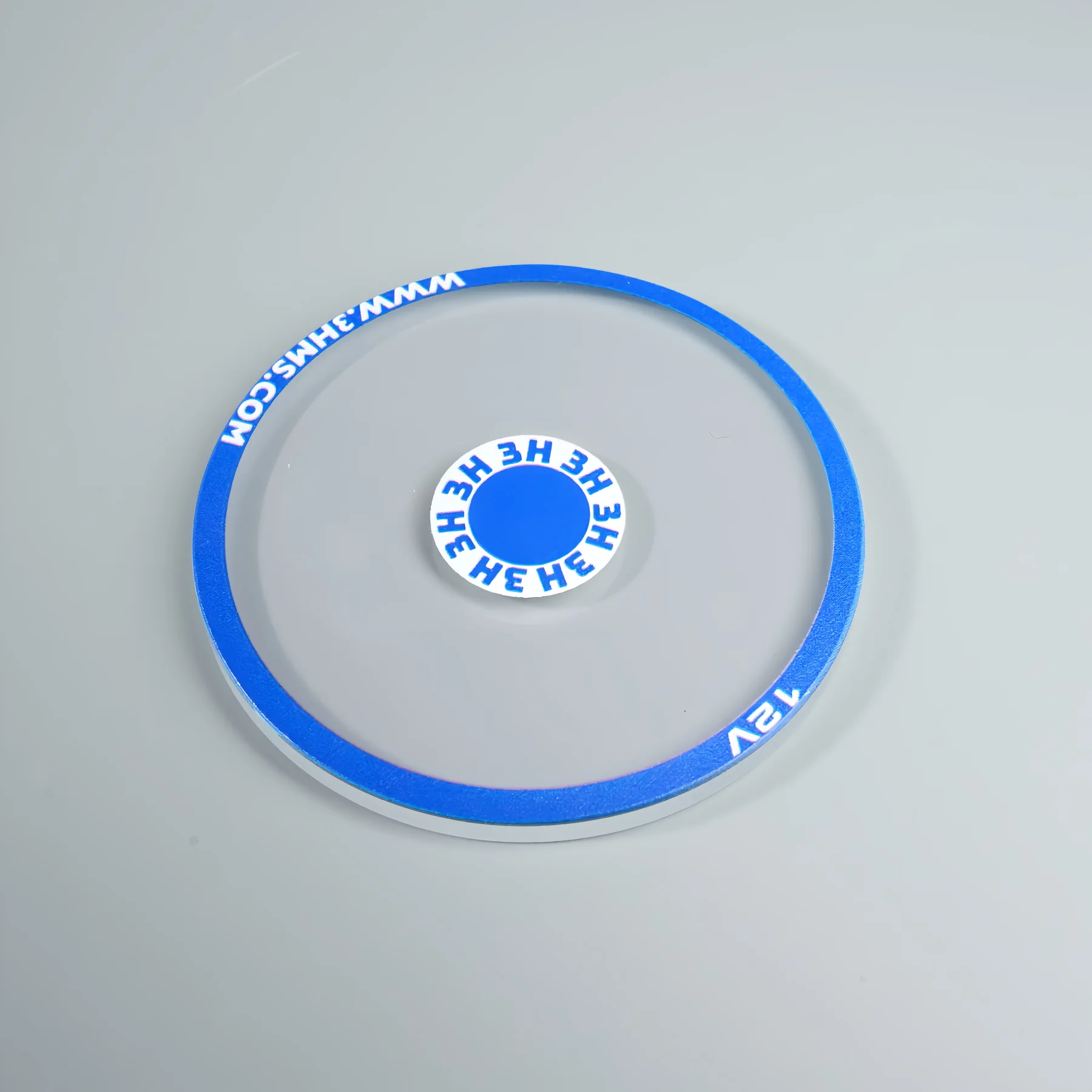 Real circular glass component with blue and white multicolor screen printing.