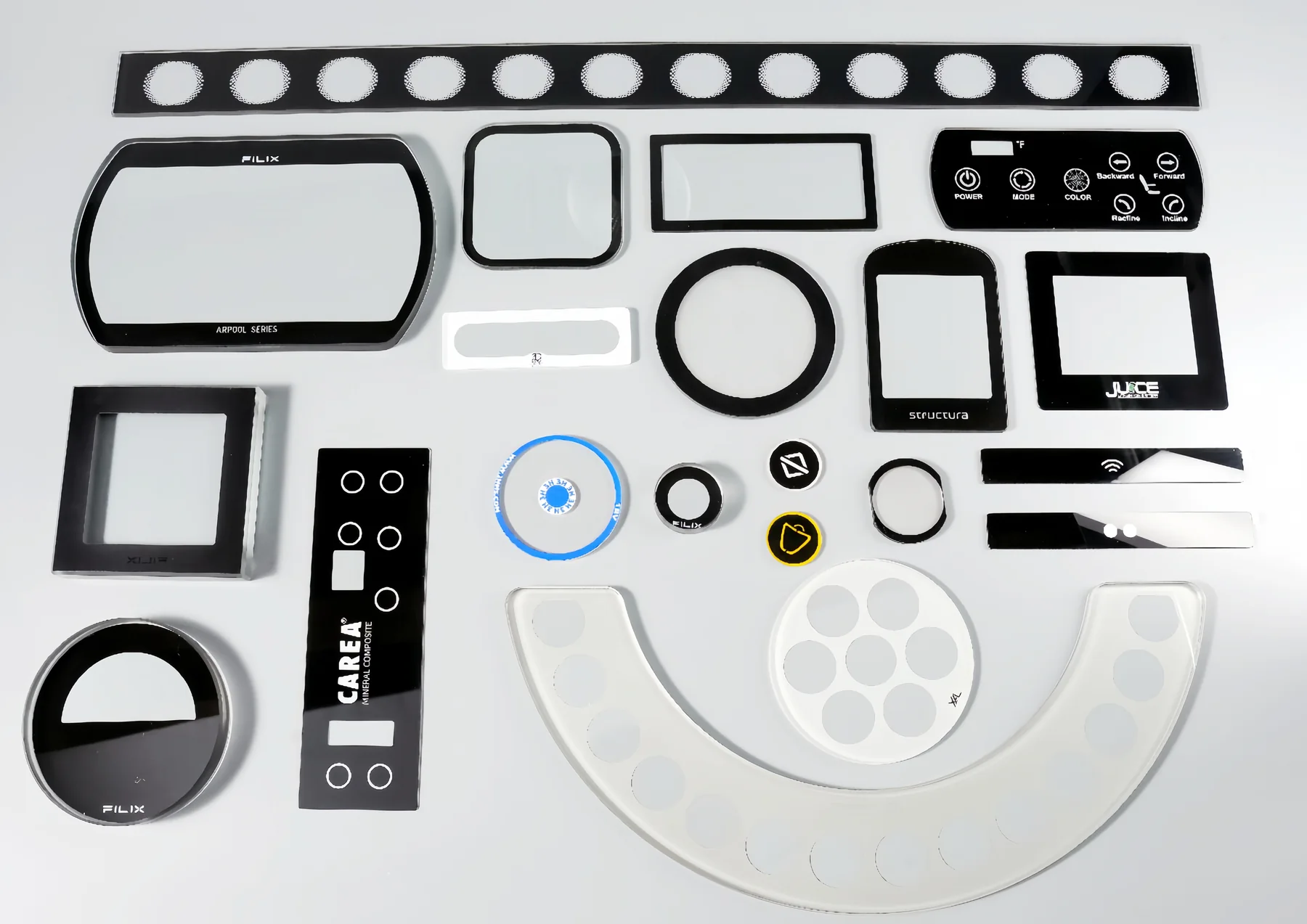 Real screen-printed glass product assortment showing different geometries, borders, symbols and transparent windows.