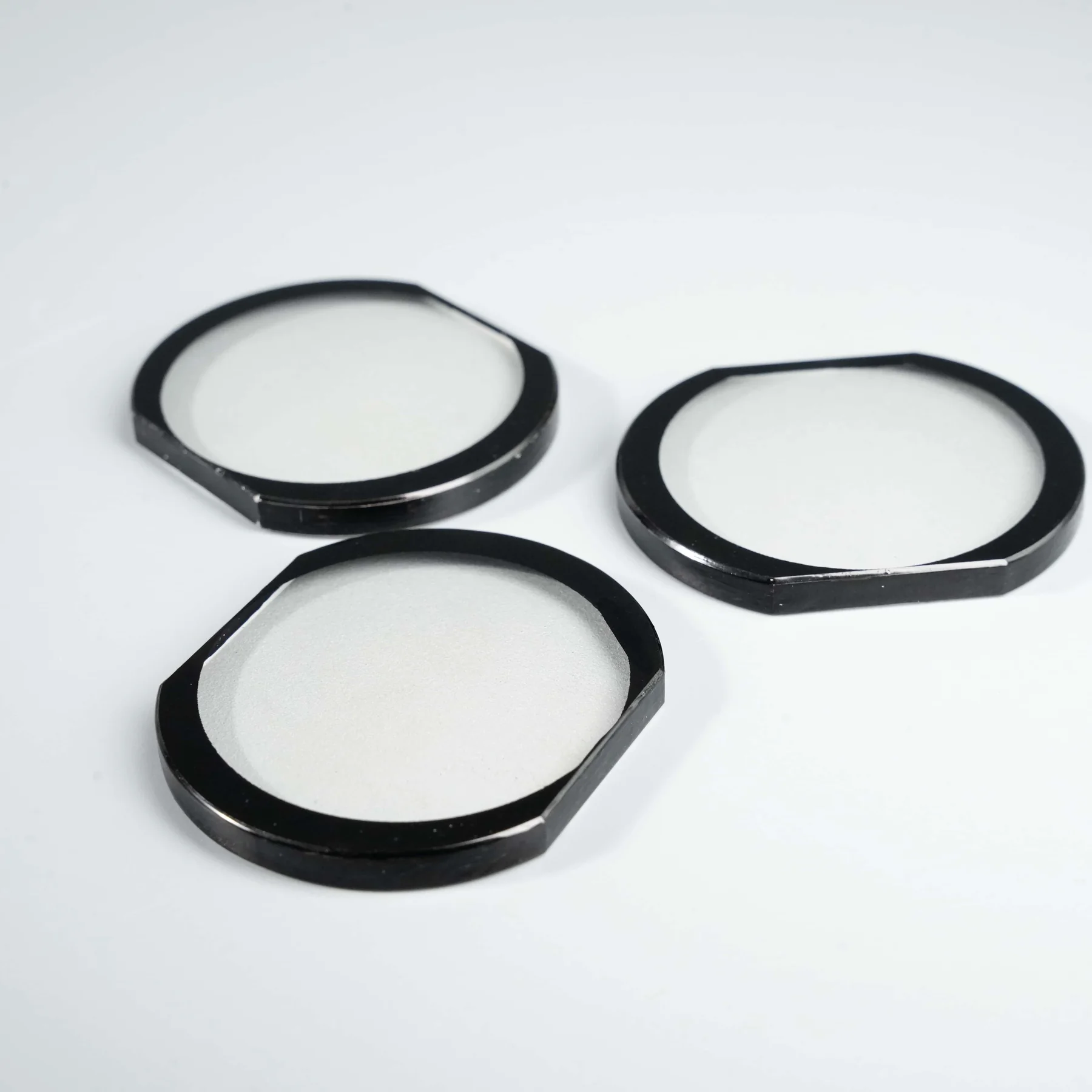 Real shaped glass rings with opaque black perimeter printing after production processing.